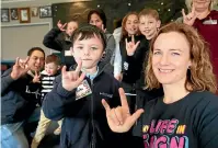  ?? KAVINDA HERATH/STUFF ?? Hard of hearing student Blake Curry, 6, and van Asch Deaf Education Centre resource teacher Cathryn Meijer say ‘‘I love you’’ in sign language.