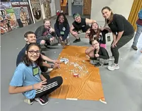  ?? ?? Emily Goldman, far right, works as a volunteer counselor for teenage girls at Camp Susquehann­a.