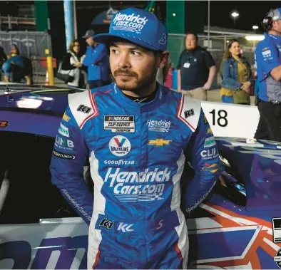 ?? JOHN RAOUX/AP ?? Kyle Larson stands by his car on after qualifying for the Daytona 500 on Wednesday at Daytona Internatio­nal Speedway.