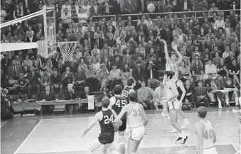  ?? AP PHOTO/JACK THORNELL ?? LSU’s Pete Maravich (23) breaks the all-time NCAA scoring record with this shot against Ole Miss on Jan. 31, 1970, in Baton Rouge, La. His record could be eclipsed as soon as Sunday afternoon by Iowa women’s basketball star Caitlin Clark.