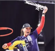  ?? Carmen Mandato / Getty Images ?? Arizona coach Adia Barnes cuts down the net after defeating Indiana in the Elite Eight on Monday.