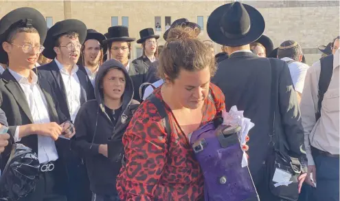  ?? (Irena Lott/Courtesy of Women of the Wall) ?? 39 SIDDURIM were torn this past Friday morning at the Kotel by ultra-Orthodox men and children.