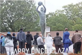  ?? JOE RONDONE/THE COMMERCIAL APPEAL ?? People gather for the dedication ceremony for the Larry Finch Plaza, a tribute to the late Memphis basketball legend at the Laurie-walton Family Basketball Center on Oct. 28.