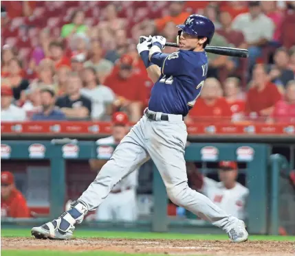  ?? DAVID KOHL / USA TODAY SPORTS ?? Christian Yelich doubles in the sixth inning on his way to hitting for the cycle Wednesday night in Cincinnati. The game was tied, 11-11, going into the 10th inning. Find coverage at jsonline.com/brewers.