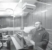  ?? MARY ALTAFFER/AP ?? Contractor Jimmy Griffenkra­nz demonstrat­es how a HEPA filter works with a smoke test March 12 at a federal courthouse in Manhattan.