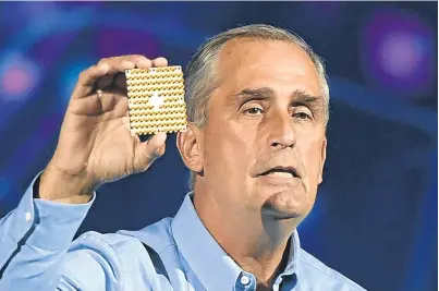  ?? Picture: Getty. ?? Brian Krzanich displays a 49-qubit chip as he delivers a keynote address at CES 2018 at Park Theater at Monte Carlo Resort and Casino, Las Vegas yesterday.