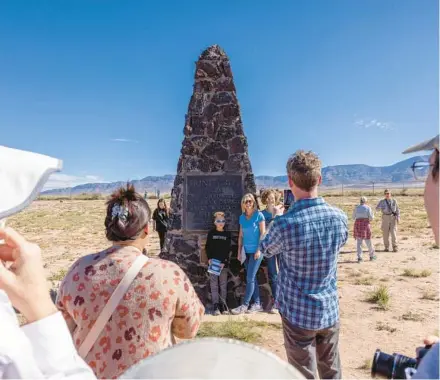  ?? JOHN BURCHAM/THE NEW YORK TIMES PHOTOS 2022 ?? Tourists visit the Trinity Site obelisk, which marks ground zero at White Sands Missile Range in New Mexico.