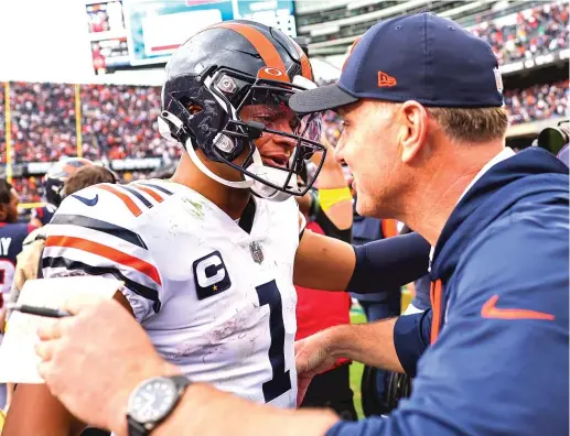  ?? MICHAEL REAVES/GETTY IMAGES ?? Quarterbac­k Justin Fields and coach Matt Eberflus still have a lot to prove in the Bears’ last nine games.