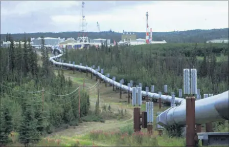  ?? AL GRILLO — THE ASSOCIATED PRESS FILE ?? In this undated file photo the Trans-Alaska pipeline and pump station north of Fairbanks, Alaska is shown. Congressio­nal Democrats are moving to reinstate regulation­s designed to limit potent greenhouse gas emissions from oil and gas fields. It’s part of a broader effort by the Biden administra­tion to combat climate change.