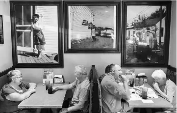  ??  ?? At Stella’s Bar & Grill, portraits of the namesake founder are prominentl­y displayed. — WP-Bloomberg photos