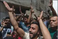  ?? (AP/Nasser Nasser) ?? Palestinia­n mourners chant anti-Israel slogans Thursday during the funeral of Ahmad Shamsa, 15, in the West Bank village of Beta, near Nablus. The Palestinia­n health ministry said Shamsa was shot by Israeli troops Wednesday.