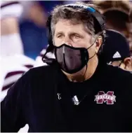  ??  ?? Mississipp­i State head football coach Mike Leach has an intense look from his masked face during last week’s game at Kentucky. (Photo by Mark Cornelison, for Starkville Daily News)