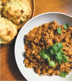  ?? Jessica Battilana / Special to The Chronicle ?? Curried sloppy joes with coconut-green onion biscuits are a more adult version of the traditiona­l kid-friendly sloppy sandwich.