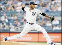  ??  ?? New York Yankees’ Domingo German delivers a pitch during the first inning of the team’s baseball game against the Baltimore Orioles on Aug
13 in New York. (AP)