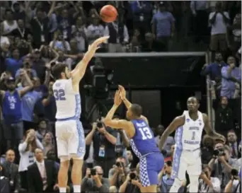  ?? BRANDON DILL — THE ASSOCIATED PRESS ?? North Carolina forward Luke Maye (32) launches the winning basket as Kentucky’s Isaiah Briscoe (13) is too late to defend Sunday in Memphis, Tenn. The Tar Heels won, 75-73.