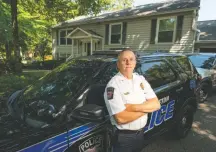  ?? CRAIG Hudson FOR THE Washington Post ?? Police Chief Earl Fox, outside Crofton Town Hall in Maryland, runs a three-officer department in Anne Arundel County.