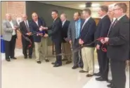  ?? DIGITAL FIRST MEDIA FILE PHOTO ?? Former Pottsgrove School Board President Matt Alexander and Superinten­dent William Shirk cut the ribbon last year dedicating the expanded and renovated Pottsgrove High School