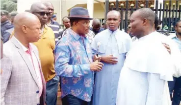  ??  ?? The church priest briefing the Anambra State governor, Willie Obiano on the attack on St. Philips Catholic Church, Ozubulu. Behind him is the Commission­er of Police, Garba Umar.