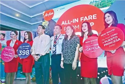  ?? SUNSTAR FOTO / AMPER CAMPAÑA ?? TRAVEL OPTIONS. AirAsia officials, along with Department of Tourism 7 Director Catalino Chan III (third from left), launch new routes for Cebu in time for the summer.