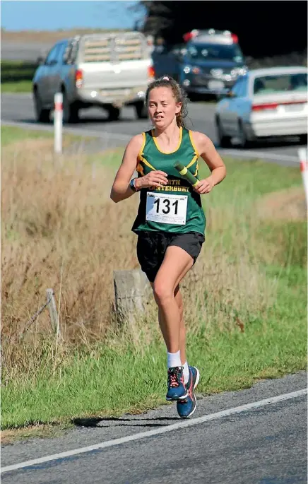  ?? PHOTO SUPPLIED ?? Navajo Prentice carries the baton for North Canterbury during her leg of the Takahe to Akaroa road relay on Saturday.