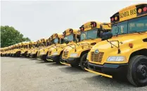  ?? CAROLE CARLSON/POST-TRIBUNE ?? New school buses are lined up at Illinois Central Bus Co.’s new Gary facility at 3401 E. 15th Ave.