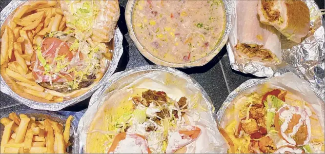  ?? Susie Davidson Powell / For the Times Union ?? An array of to-go food from Shebamz Grill in Albany.