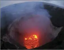  ?? U.S. GEOLOGICAL SURVEY VIA AP ?? This photo provided by the U.S. Geological Survey shows the lava lake at the summit of Kilauea near Pahoa, Hawaii. Hawaii’s erupting Kilauea volcano has destroyed homes and forced the evacuation­s of more than a thousand people.