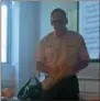  ?? KATHLEEN CAREY — DIGITAL FIRST MEDIA ?? Ian Stoddart demonstrat­es how to apply pressure to stop bleeding from a wound at a school safety seminar for teachers last week.