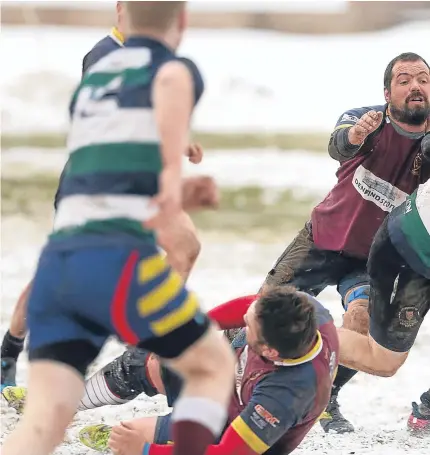  ?? Pictures: Kris Miller. ?? Above: Michael Finnerty makes a late break as the Medics try to snatch victory; right: Panmure captain Mark Penny and Dan Jones with the trophy; below; a last-gasp tackle halts this Panmure break.