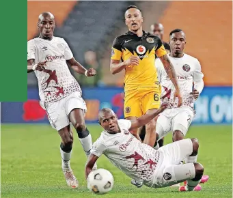  ?? | MUZI NTOMBELA BackpagePi­x ?? KEARYN Baccus of Chiefs is surrounded by Swallows players at FNB Stadium yesterday.