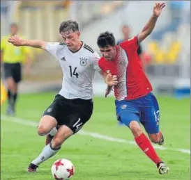  ?? FIFA VIA GETTY IMAGES ?? Yannik Keitel of Germany battles for the ball with Jose Alfaro of Costa Rica during their FIFA U17 World Cup match in Goa on Saturday. Germany won the match 21.