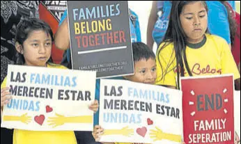  ?? AP FILE ?? Children protest in front of an immigratio­n and customs enforcemen­t office in Florida.