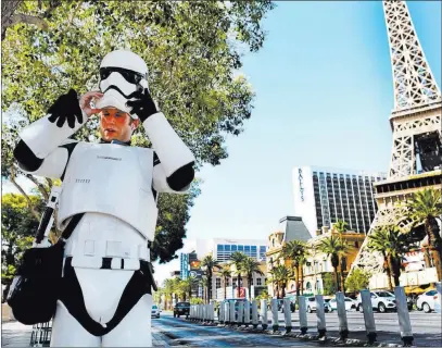  ?? Elizabeth Brumley ?? Las Vegas Review-journal Adam Reynolds, a street performer, works Monday in 113-degree heat near Bellagio. The forecast calls for even higher temps today.