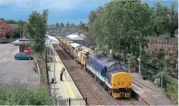  ?? Chris Morrison ?? DRS Regional Railways liveried 37425 Sir Robert Mcalpine / Concrete Bob passes Evesham with 6Y03, the 06:46 Eastleigh to Long Marston conveying a high output ballast cleaner for storage on August 2.