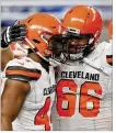  ?? Browns. GREGORY SHAMUS/GETTY IMAGES ?? Nate Orchard (left) celebrates his touchdown with Spencer Drango after an intercepti­on return Thursday, but both were waived by the