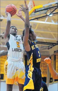  ??  ?? Williams, left, puts up a shot against St. Francis de Sales.