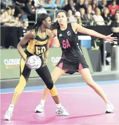  ?? FILE ?? Jamaica’s Malysha Kelly (left) holds the ball as she is shielded by New Zealand’s Maria Tutaia during a World Fast5 Netball Series semi-final match in Auckland, New Zealand in 2012.