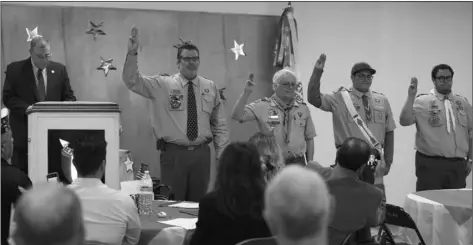 ?? COURTESY PHOTO ?? Tim Kelley (left) invites all Eagle Scouts present, to join Dominic Fiorenza (second from right) in reciting the Boy Scout Oath.