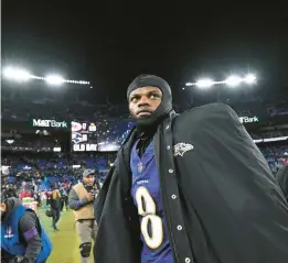  ?? KENNETH K. LAM/STAFF ?? Ravens quarterbac­k Lamar Jackson walks off the field after losing to the Chiefs in the AFC championsh­ip game Jan. 28.