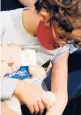  ?? JEFF KOWALSKY/GETTY-AFP ?? A child receives a Pfizer vaccine Nov. 5 in Southfield, Michigan, near Detroit.