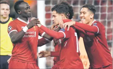  ??  ?? Liverpool’s Brazilian midfielder Philippe Coutinho (centre) celebrates scoring their fifth goal and completing his hattrick with Liverpool’s Egyptian midfielder Mohamed Salah (second left), Liverpool’s Brazilian midfielder Roberto Firmino (right) and...