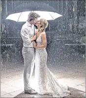  ?? BOB CARE — FLORIDA KEYS NEWS BUREAU VIA AP ?? Subtropica­l Storm Alberto spoiled the plans of Hannibal and Emily Baldwin have an outdoor wedding, on Saturday.