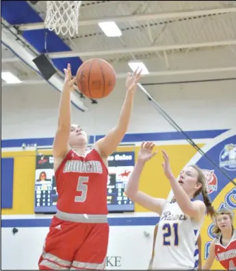  ?? Staff photo/ Jake Dowling ?? New Knoxville’s Morgan Leffel ( 5) grabs the rebound before St. Marys’ Kiley Tennant ( 21) can get to get during a non- conference girls basketball game.