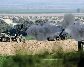  ?? /Reuters ?? Military offensive: An Israeli mobile artillery unit fires towards Gaza amid a push to capture Khan Younis in the south.