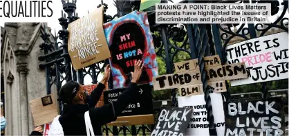  ??  ?? MAKING A POINT: Black Lives Matters protests have highlighte­d the issues of discrimina­tion and prejudice in Britain