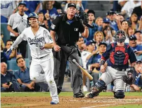  ?? Mark J. Terrill / Associated Press ?? Joc Pederson of the Dodgers watches his home run against the Red Sox during the third inning of Game 3 of the World Series on Friday at Dodger Stadium.