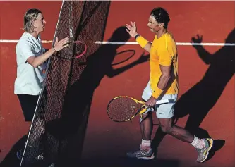  ?? DEAN MOUHTAROPO­ULOS
GETTY IMAGES ?? Rafael Nadal, right, of Spain shakes hands with Denis Shapovalov after the beating the 19-year-old Canadian during the fifth day of the Italian Open tennis tournament Thursday in Rome, 6-4, 6-1.