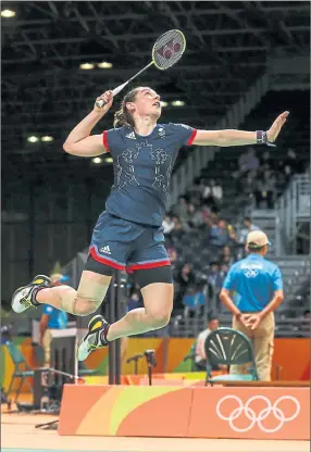  ??  ?? NET GAINS: Kirsty Gilmour attempts a smash in the mixed doubles semi-final.