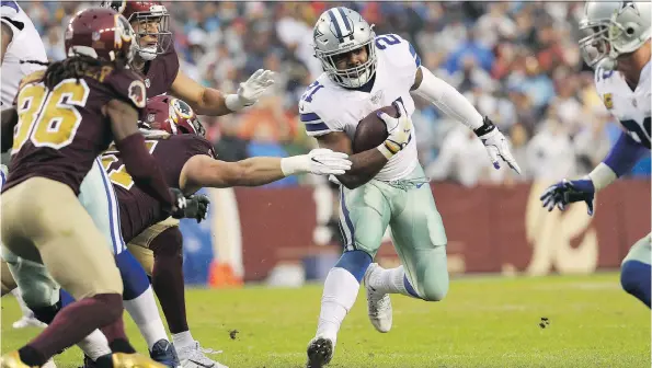  ?? PATRICK SMITH/GETTY IMAGES ?? Running back Ezekiel Elliott of the Dallas Cowboys runs upfield against the Washington Redskins during the second quarter at FedEx Field Sunday.