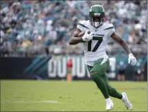  ?? PHELAN M. EBENHACK ?? New York Jets wide receiver Vyncint Smith (17) runs after catching a pass during the second half of an NFL football game against the Jacksonvil­le Jaguars in Jacksonvil­le, Fla. Vyncint Smith had surgery Tuesday, Aug. 18, 2020, to repair a core muscle injury and could be sidelined up to two months. Adam Gase confirmed the procedure and prognosis, saying Smith will likely miss 5-to-8 weeks.